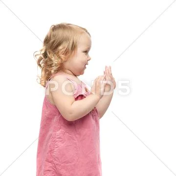 Young little girl standing over isolated white background Stock Photos