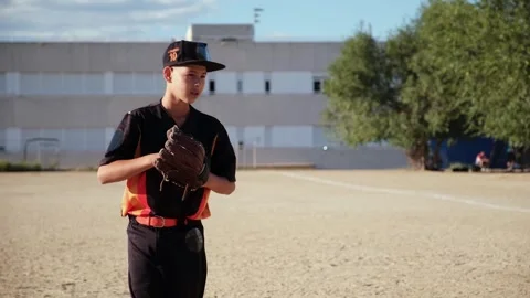 Young little league baseball pitcher throwing ball Stock Footage 318064572