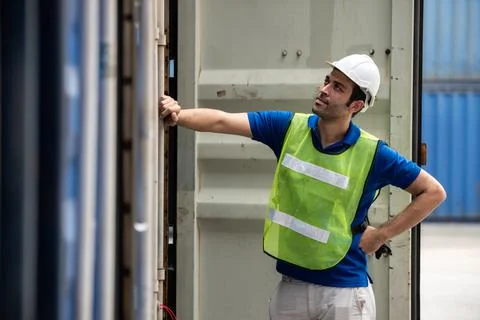 Young logistic worker man wearing worker uniform found out making mistakes at Stock Photos