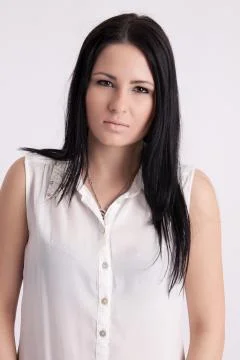 Young long-haired black-haired woman Stock Photos