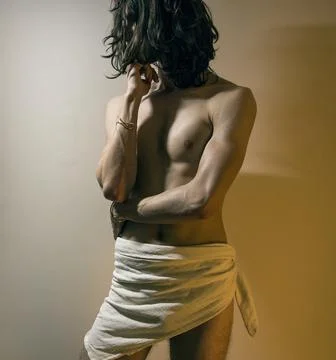 Young long haired man standing in defensive position Stock Photos