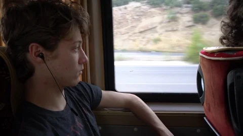 Young Looks Out Of A Train Window Vidéo 97085931