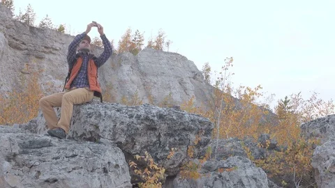 Young, Lost Man With Smartphone Looking For Direction On mountain. Stock-Footage 70016579