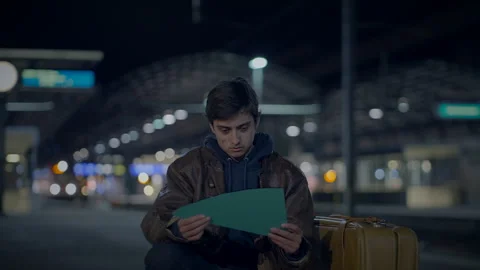 Young Lost Man with Suitcase Finding Broken Mirror on Urban Street at Night Stock Footage 270975190
