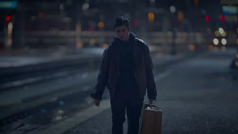 Young Lost Man with Suitcase Finding Broken Mirror on Urban Street at Night Stock Footage 271009098