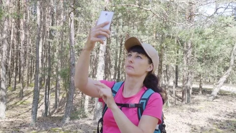 Young, Lost Woman With Smartphone Looking For Direction On The Forest. Girl u Stock Footage