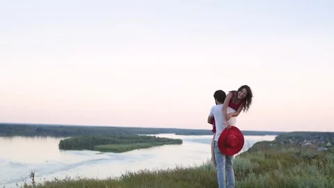 Young love Couple smiling under blue sky.happy couple have fun in nature. a man Stock-Footage 147000182
