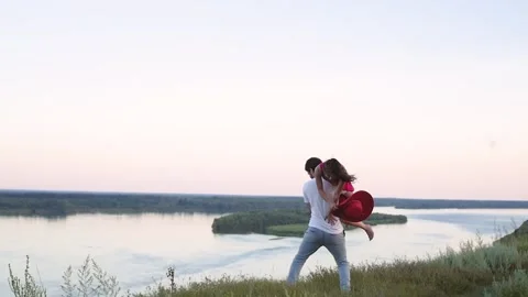 Young love Couple smiling under blue sky.happy couple have fun in nature. a man Vídeo Stock 147110729