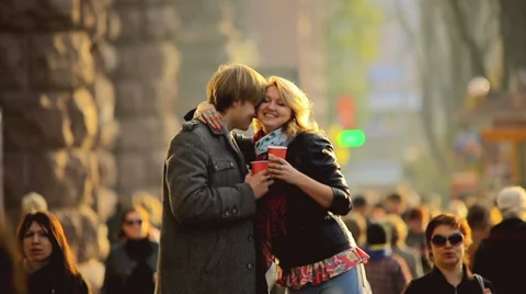 The young lovers with tea cups above the people crowd, REAL TIME Stock Footage 32527875