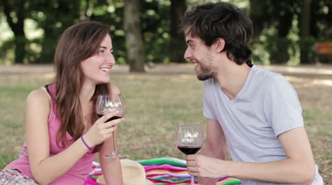Young lovers toasting with red wine at the camera Video stock 28498302