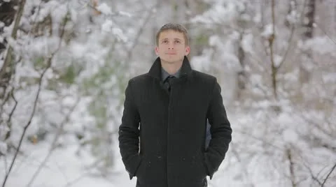 The young lovers walk and rest in the winter forest, SNOWFALL weather Stock Footage