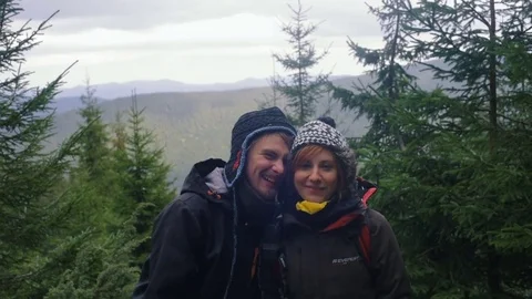 Young loving couple having fun in mountain forest Stock Footage 82819954