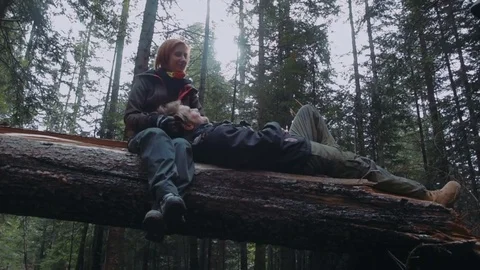 Young loving couple having fun in mountain forest Video stock 82829248