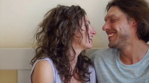 Young Loving Couple Hugging and Kissing in Bed Stock Footage 81671602