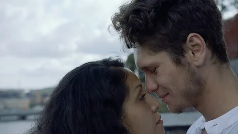 A young loving couple looking into each other's eyes and rubbing their noses Stock-Footage 116072659