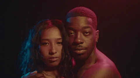 Young Loving Couple Posing Under Neon Light Stock Footage 236683453