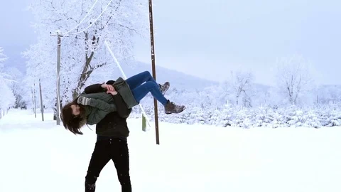 Young loving couple screwing in the open air, walking in winter Park Stock Footage 84937366