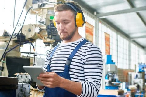 Young Machine Operator Working at Plant Stock Photos