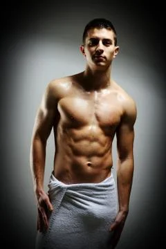 Young macho man using white towel Stock Photos