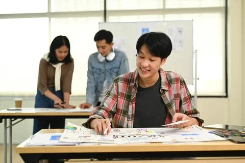 Young male application developers working on new website wireframe, planning Stock Photos