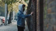 Young Male Artist Drawing A Street Art Graffiti With Aerosol Spray Bottle On The Stock Footage