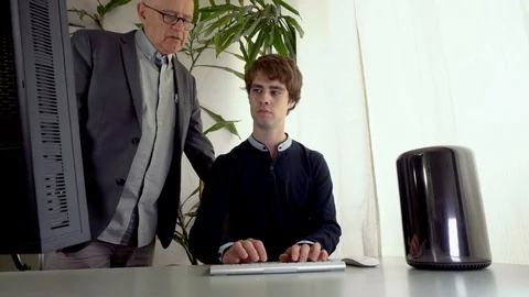 Young Male Assistant Typing on Computer While Boss Dictates What To Write 스톡 동영상 113081445