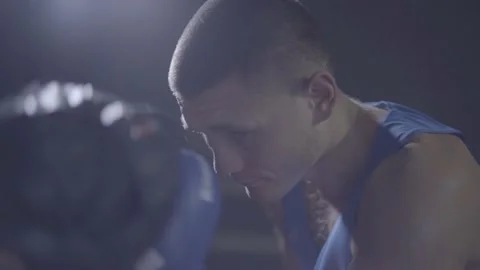 Young male athlete boxer fighter personal coach practicing workout training hook Stock Footage 137539853
