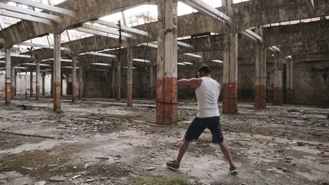 Young male boxer doing shadow boxing exercise. Stock Footage 79346967