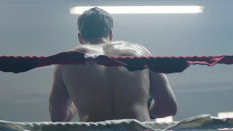 Young male boxer doing shadow fight while training Stock Footage 181833427