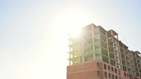 Young male builder engineer architect foreman in protective helmet walks with Stock Footage 204842264