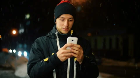 Young male in the city using his smartphone. Stock Footage