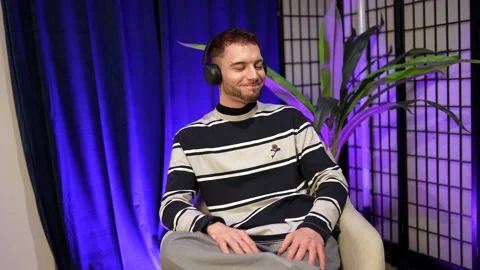 Young male content creator discussing during podcast Stock Footage 328633587