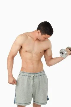 Young male doing weight lifting Stock Photos