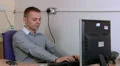 Young male getting bored at work HD Footage