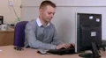Young male getting tired at work HD Footage