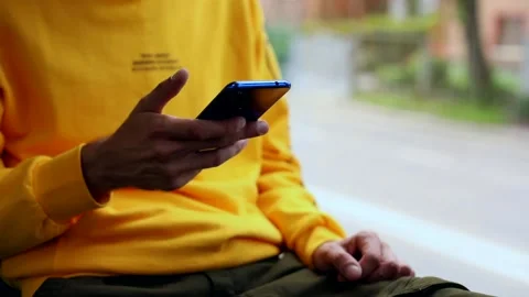 Young male hands using smart phone mobile riding in city bus. Navigation app Stock Footage 135521018