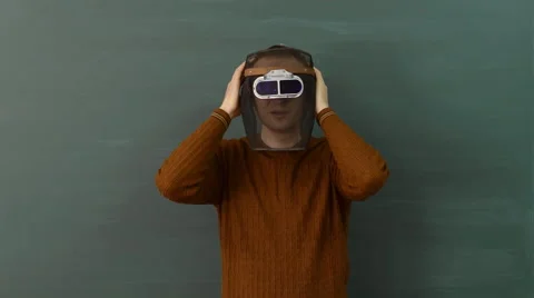 Young male instructor explains functional use and design of the welding mask Video stock 68685356