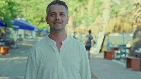 Young male looking at camera and smiling. Stock Footage 166004473