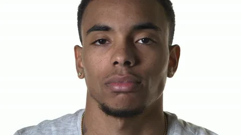 Young Male Looking into Camera in front of Seamless White Background Stock Footage 61522895