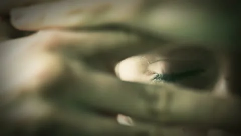 Young male peeks through his hands Stock Footage 10830462