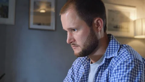 Young male professional using computer sitting at home office desk. Stock Footage 128586679