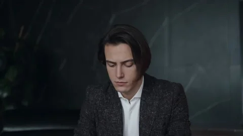 Young male professional using computer sitting at home office desk. Stock Footage 168676900