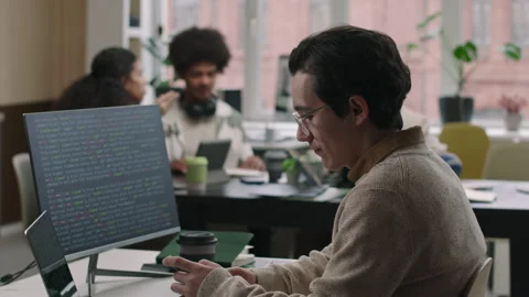 Young Male Programmer Coding in Office Stock Footage 274338252