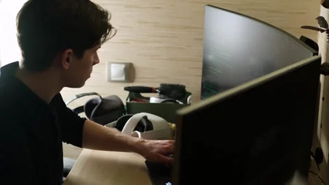 Young male, programmer developer, software engineer, IT support, working hard at Stock Footage 244905853