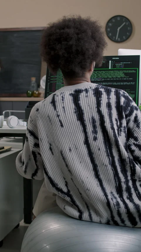 Young Male Programmer Jumping on Fit Ball and Coding in Office Stock Footage 274337211
