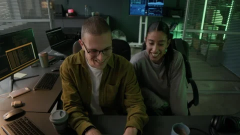 Young Male Programmer Teaching Program Coding to Junior Colleague in Office Stock Footage 292615534