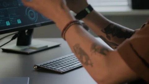 Young Male Programmer Typing and Putting On Headphones Stock Footage 292621282