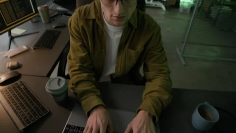 Young Male Programmer Typing on Laptop in Office in Evening Stock-Footage 292614962