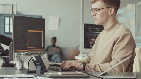 Young Male Programmer Working on Computer in Office Stock Footage 219314542