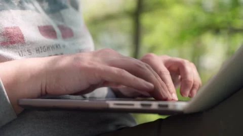 A young male programmer working at a computer outdoors. Stock Footage 241738792